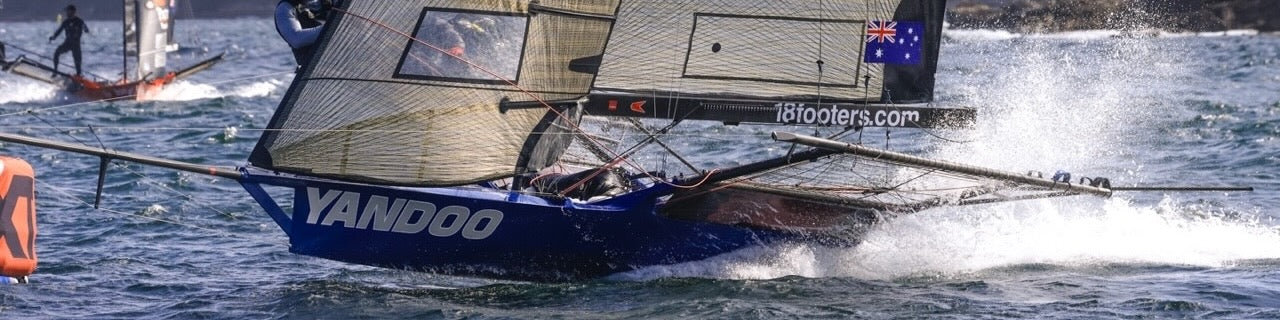 Sailboat with 'Yandoo' branding on a water background