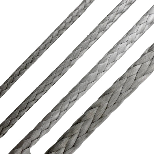 Close-up of braided metallic cable on a light gray background