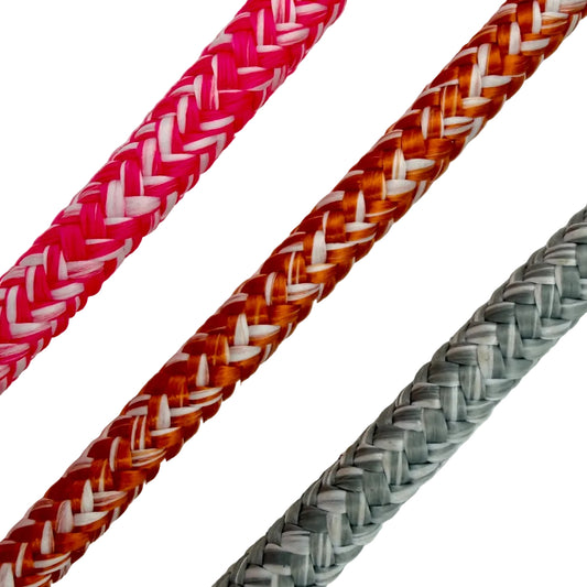 Three braided cables in pink, orange, and gray on a light background