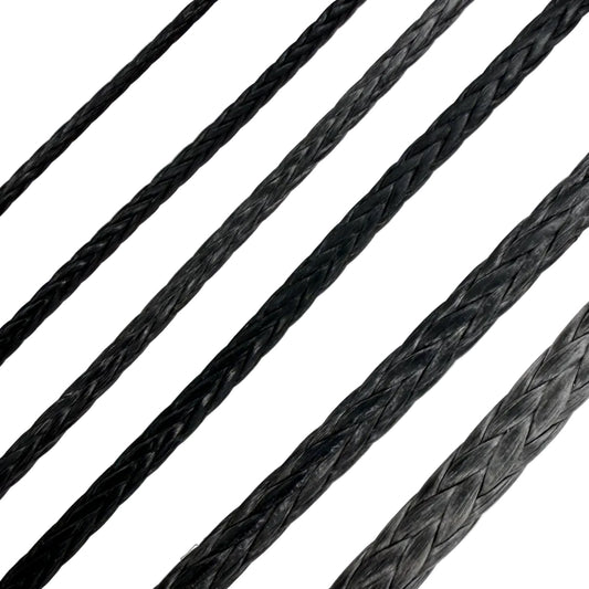 Close-up of black braided cord on a white background
